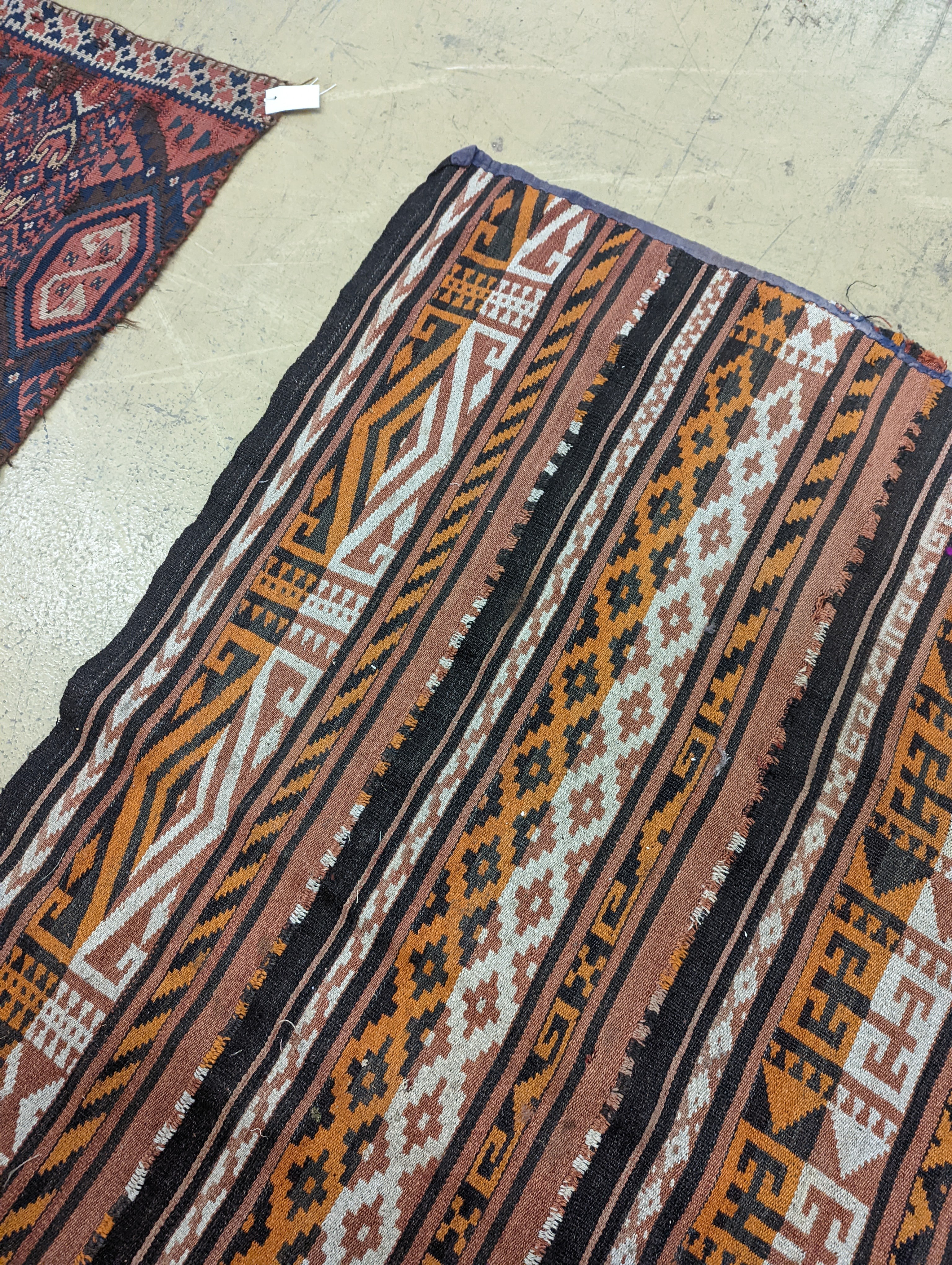 A polychrome flatweave carpet, approx. 330 x 180cm